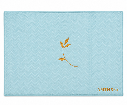 AMTH & Co Haven Blanket fully expanded in light blue with gold leaf and wordmark