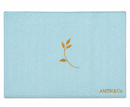 AMTH & Co Haven Blanket fully expanded in light blue with gold leaf and wordmark