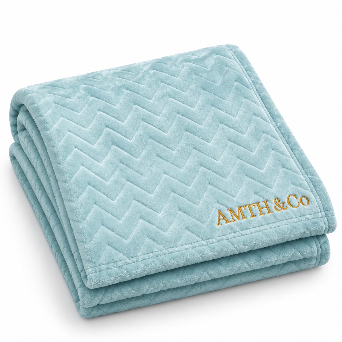AMTH & Co Haven Blanket folded in light blue with gold wordmark